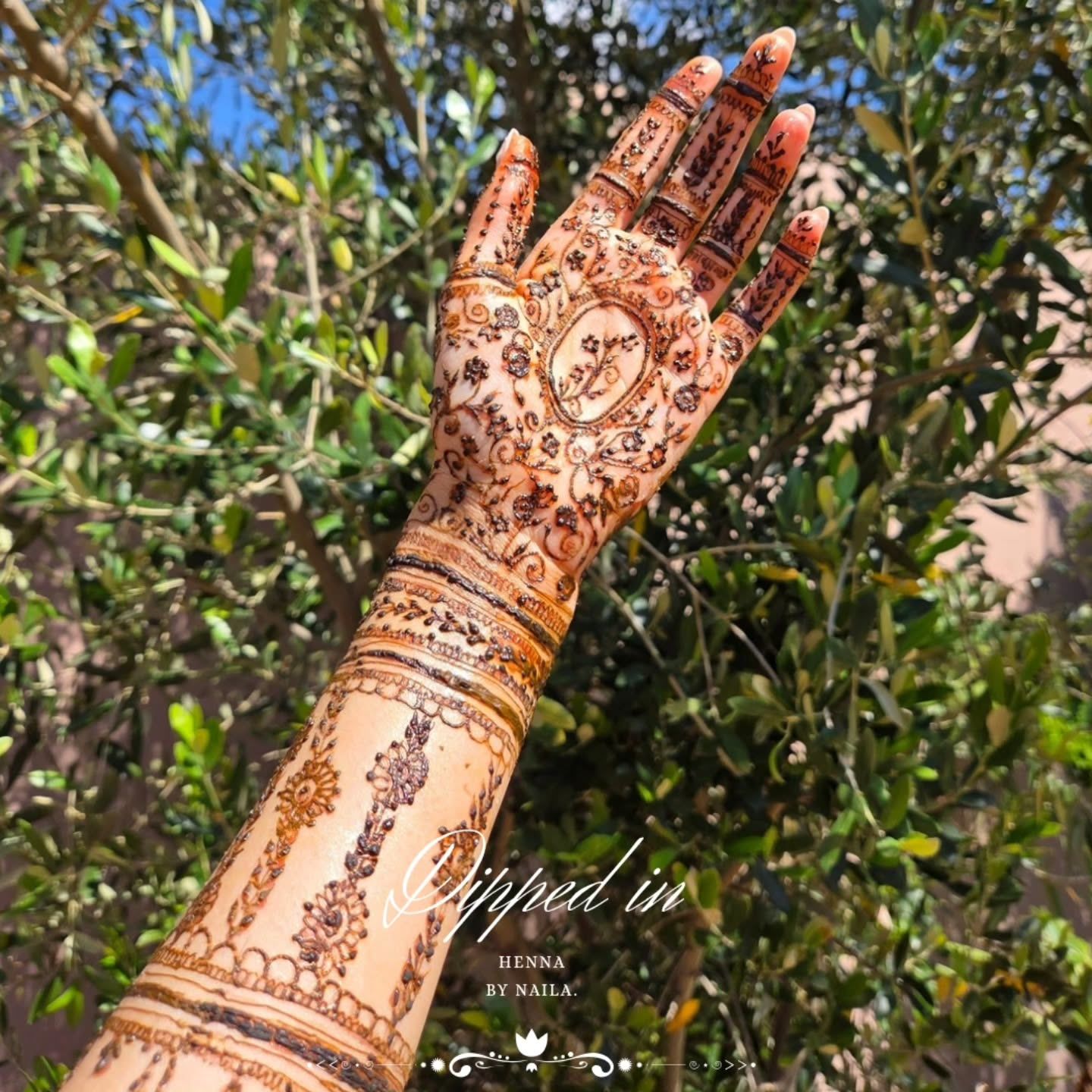 Bridal henna on the back of the hand and arm
