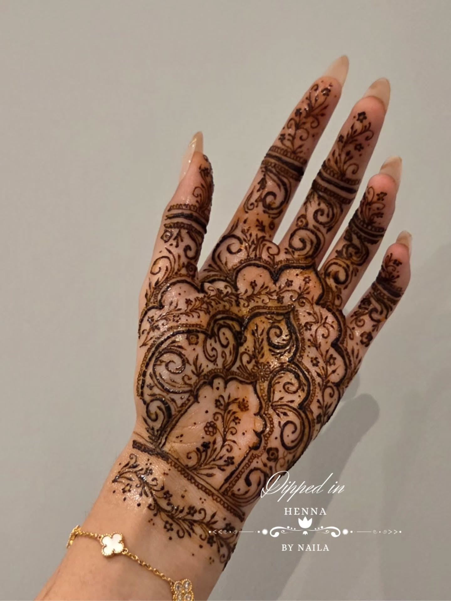 Palm with dense paisley henna