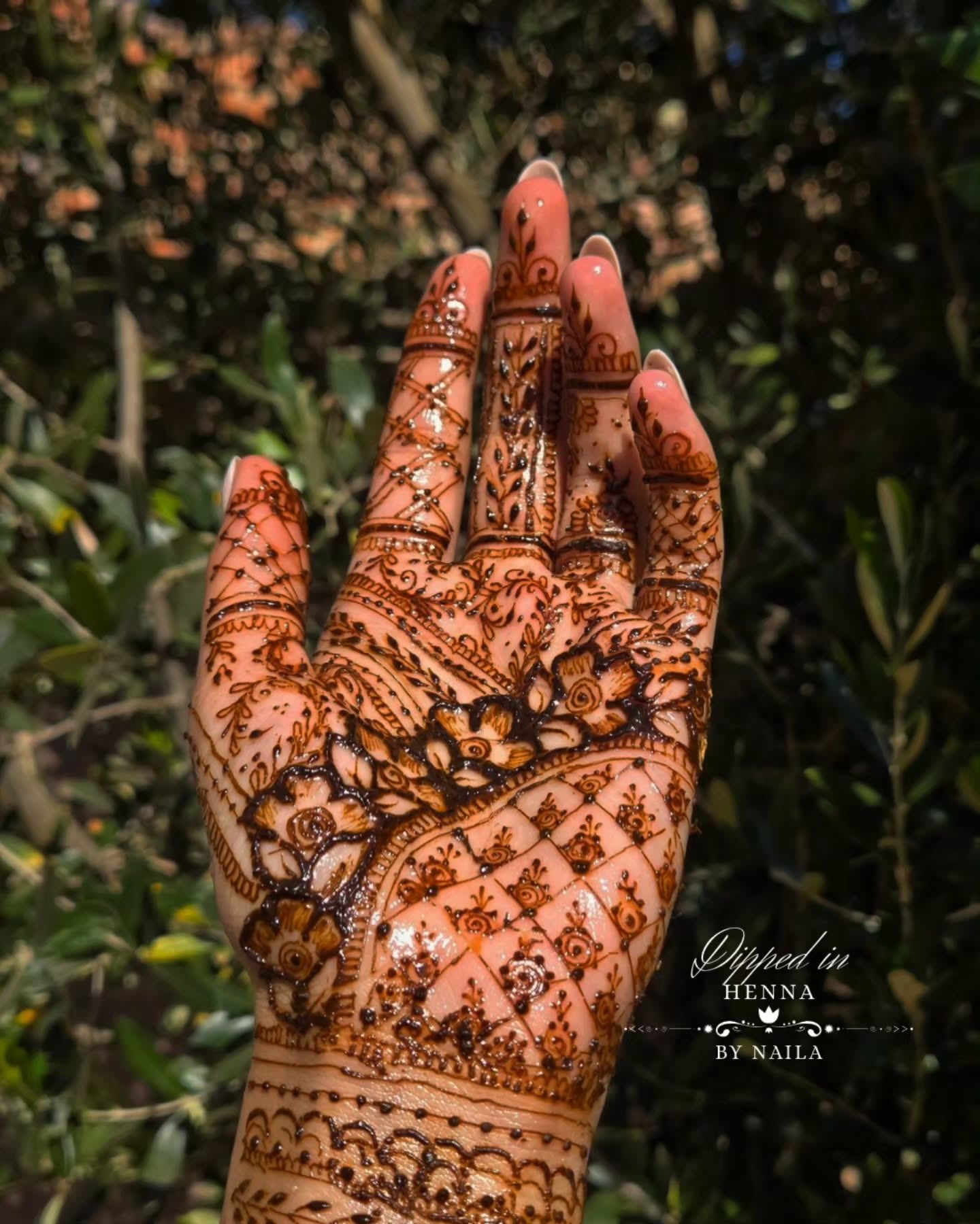 Palm with geometric and floral henna