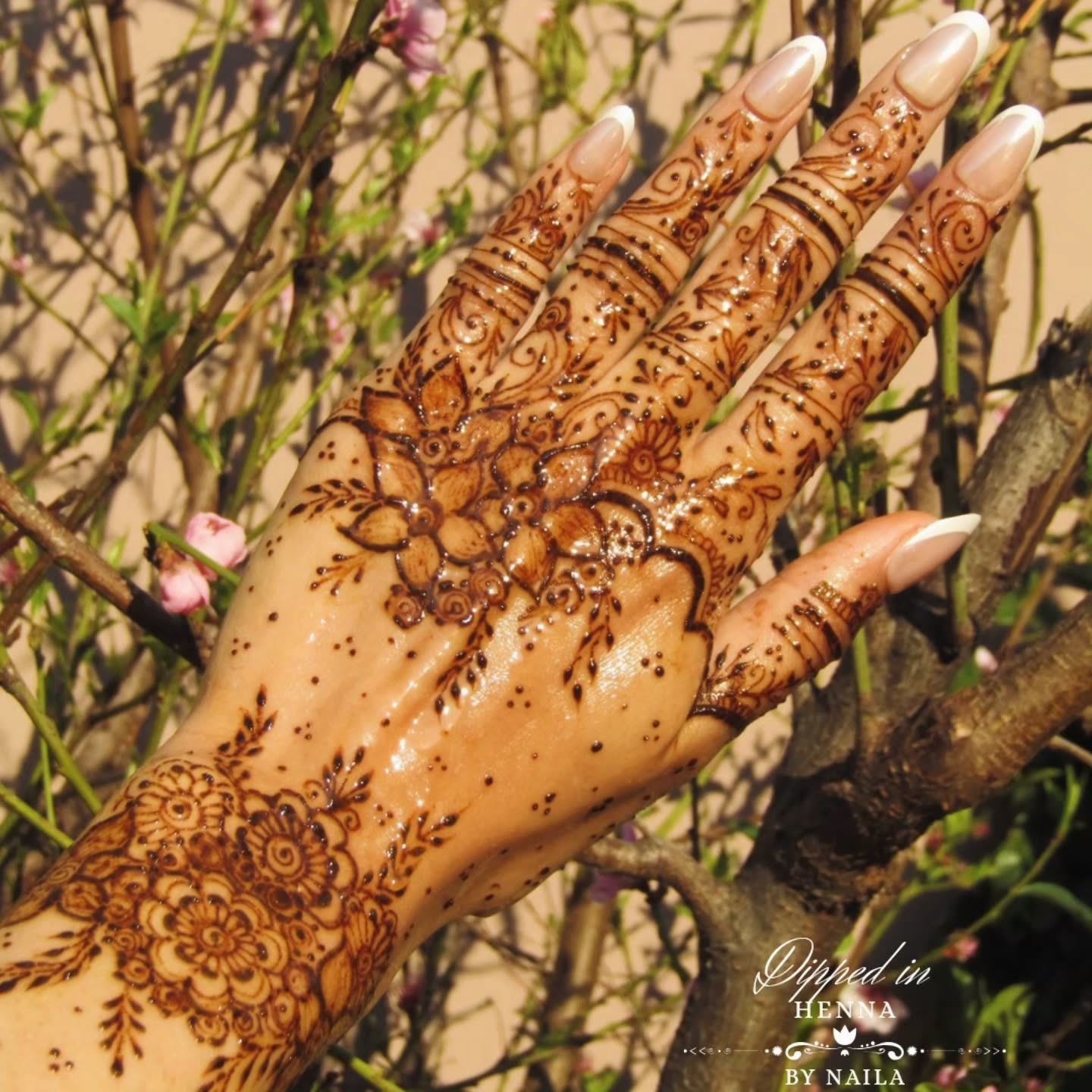 Intricate henna on the hand in golden light