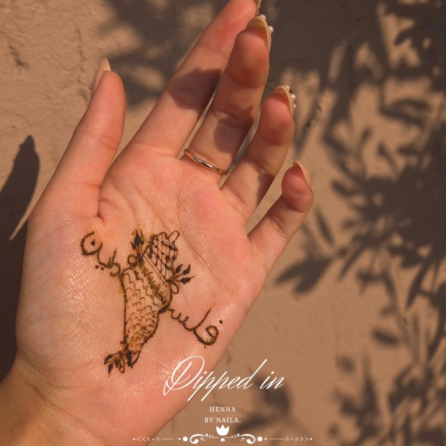 Palm with a small, simple henna design