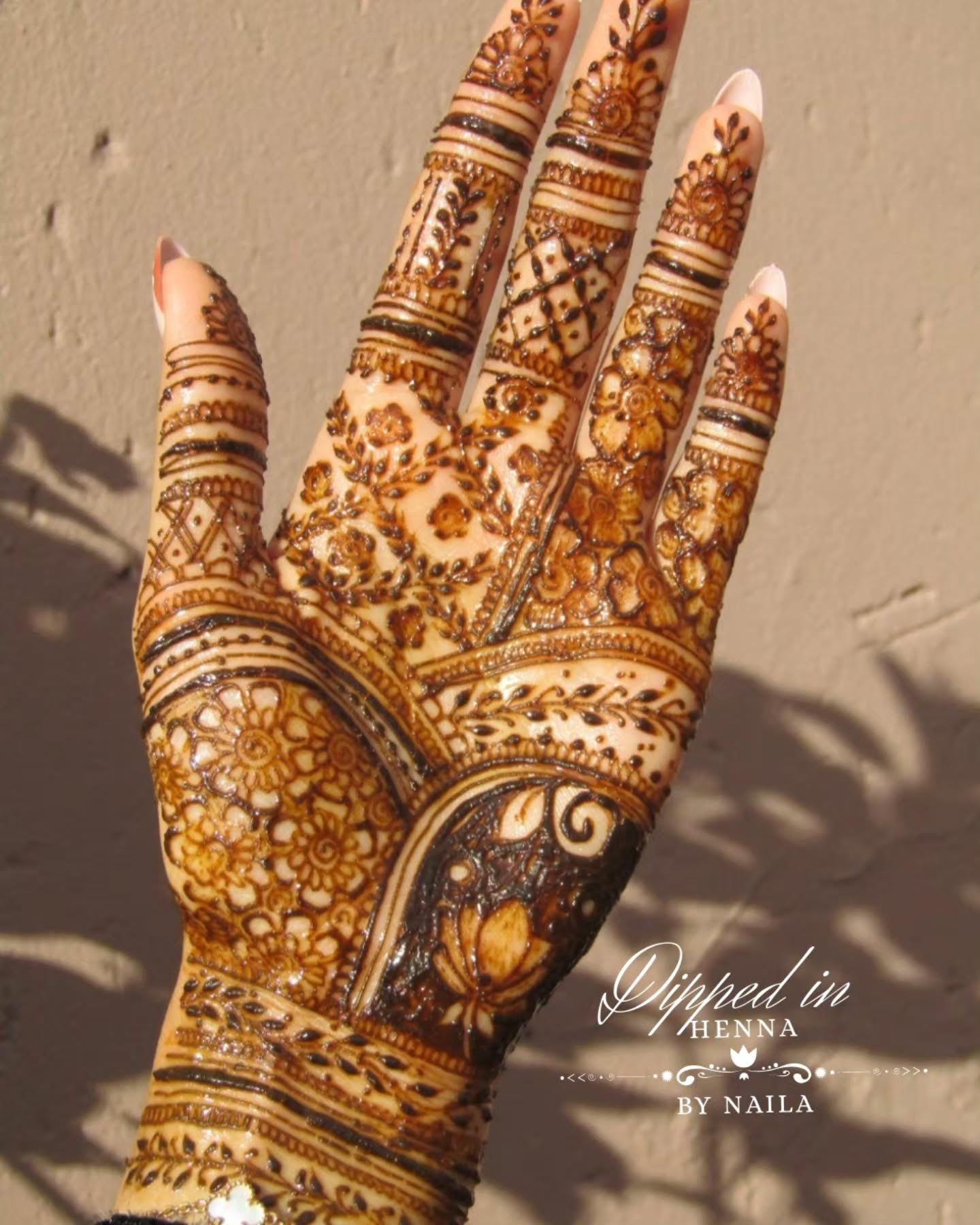 Deep mahogany stain on a detailed palm